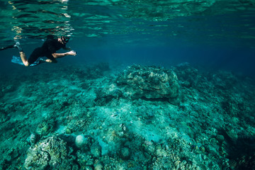 Naklejka na ściany i meble Freediver man explore sea life in ocean, underwater