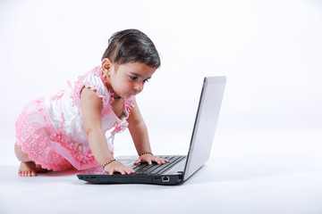Indian baby girl with laptop
