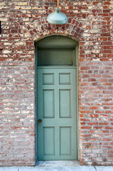 old door in brick wall