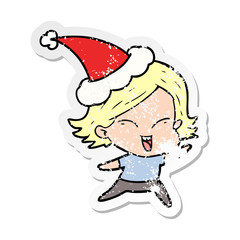 happy distressed sticker cartoon of a girl wearing santa hat