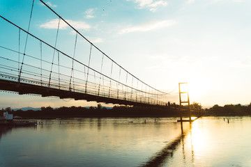 Wood small bridge walk way for sightseeing beside beach with green nature around.