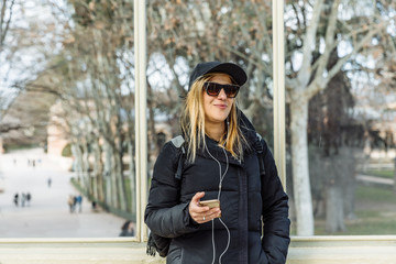 Girl listening to music on her mobile