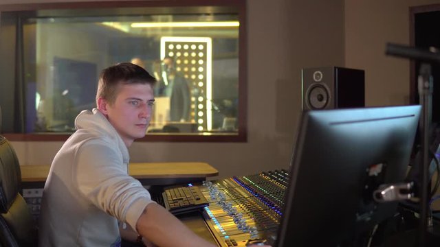 A man works in a recording studio