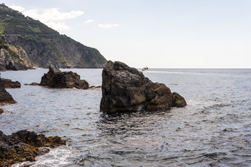 Fototapeta na wymiar Italy, Cinque Terre, Manarola, a rocky island in the middle of a body of water