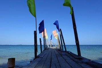 Wooden Pier And Flags