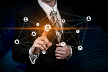 Human resource business concept. Businessman presses hr icon on virtual screen