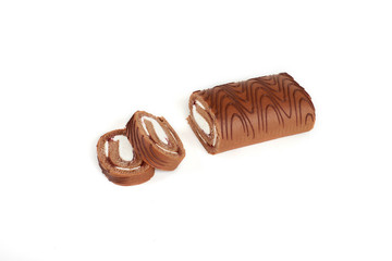 Biscuit roll cut into pieces, on a white background.