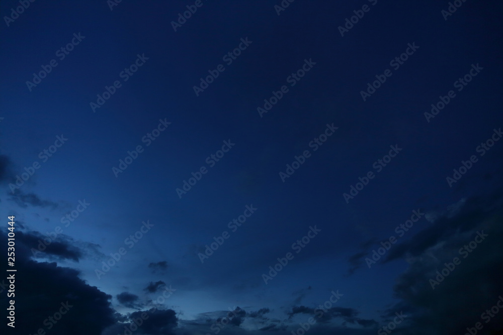 Wall mural black cloud on blue night sky
