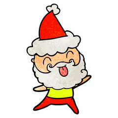 man with beard sticking out tongue wearing santa hat