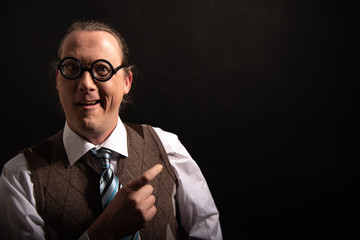 Funny nerd or geek pointing with finger smart science