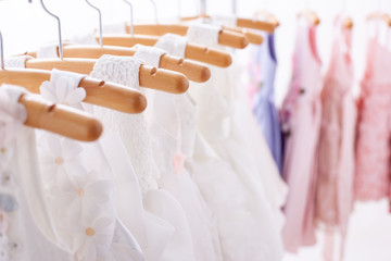 White dresses hung on hangers