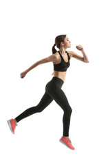 Sporty female runner on white background
