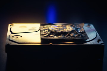 Hard disk on the table in dark colors and lighting close-up.