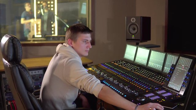 A man works in a recording studio
