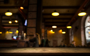Beer barrel with beer glasses on a wooden table. The dark brown background.