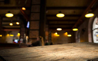 Beer barrel with beer glasses on a wooden table. The dark brown background.