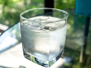 A glass of cold drinking water with ice