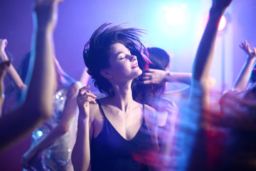 Fototapeta Beautiful young women dancing in night club obraz