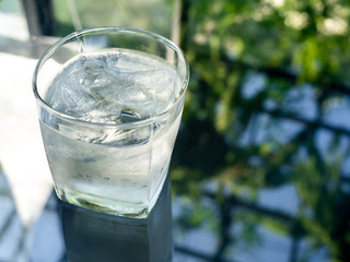 A glass of cold drinking water with ice
