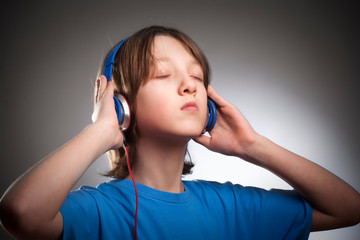 Boy Listening to Music in Headphones.