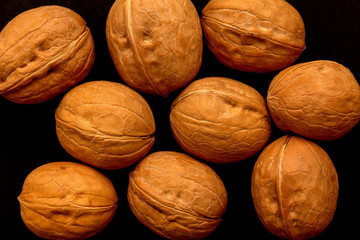 walnuts on a black background
