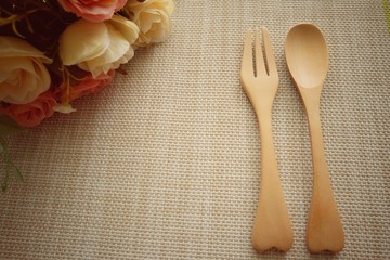 spoon and fork on wooden table