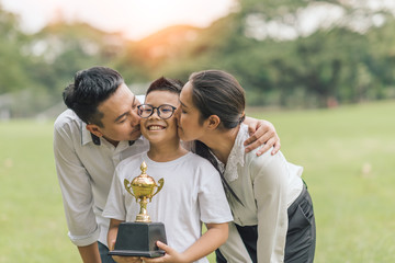Happy family asian summer holiday in garden. Group of asia family enjoyed playing at the park.