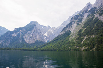 Naklejka na ściany i meble Large stone mountains in the Alps on Konigssee Lake