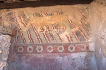 Ancient lines and colours and tiger painted on cave wall