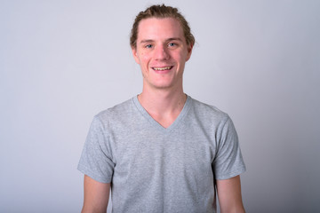 Fototapeta premium Portrait of happy young handsome man smiling