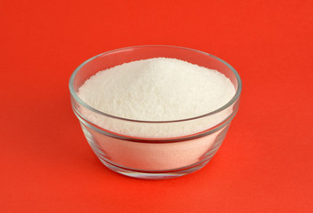 White sugar in glass bowl 