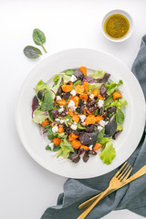 Baked beet and carrot salad with cheese