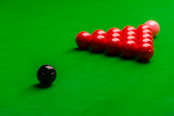 Snooker balls and table with green cloth side view