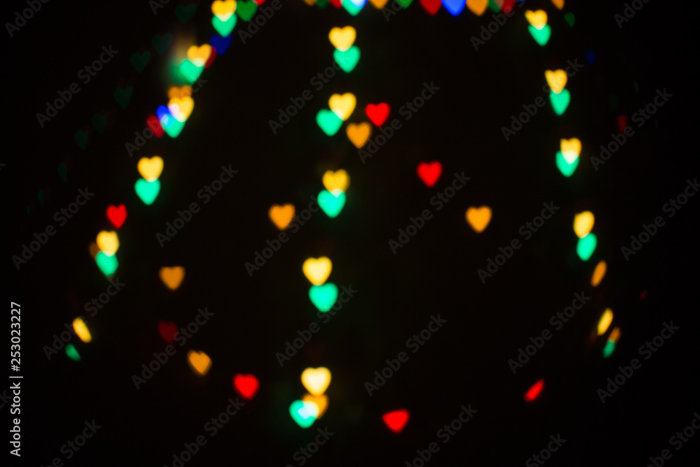 Wall mural colorful abstract heart shape blured bokeh at night