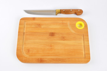 cutting board with knife on wooden board