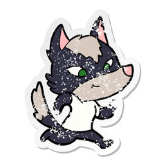 distressed sticker of a friendly cartoon wolf