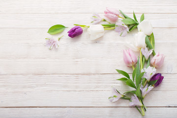 Tulips on white wooden background. Concept woman's or mother's d