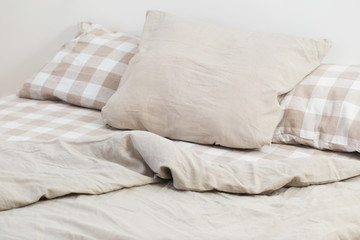 Fototapeta na wymiar light linen bedclothes on bed