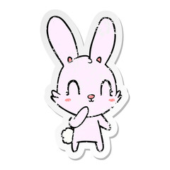 Fototapeta na wymiar distressed sticker of a cute cartoon rabbit