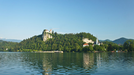 Fototapeta na wymiar Beautiful view over Lake Bled, Julian Alps mountains and Bled castle, sunny morning, Bled, Slovenia