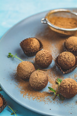 Cocoa balls, handmade chocolate balls cakes in a blue tray