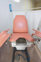 Gynecological cabinet with chair and other medical equipment in modern clinic