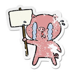 distressed sticker of a crying pig cartoon with protest sign