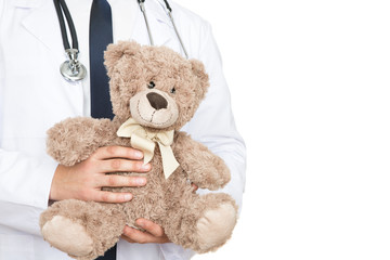 He is worth your trust. Cropped shot of a male doctor holding a teddy bear