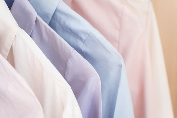 shirts with different colors hanging in a row