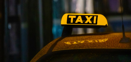 taxi lights on rainy night drive home safety