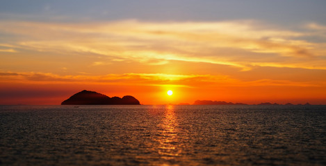 Fototapeta na wymiar Bright sunset under the sea surface in Thailand