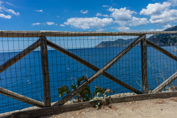 Obraz premium Italy, Cinque Terre, Manarola, a long bridge over a body of water