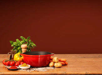 orange cooking pan with flying ingredients.