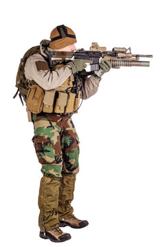 Portrait soldier or private military contractor holding automatic rifle. war, army, weapon, technology and people concept. Image on a white background.